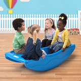 Four children rocking and laughing on the Simplay3 Rocking Bridge in the playroom