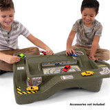 Two boys playing with green Simplay3 Monster City Extreme Wheels track