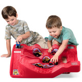 Two boys playing with red Simplay3 Monster City Extreme Wheels track