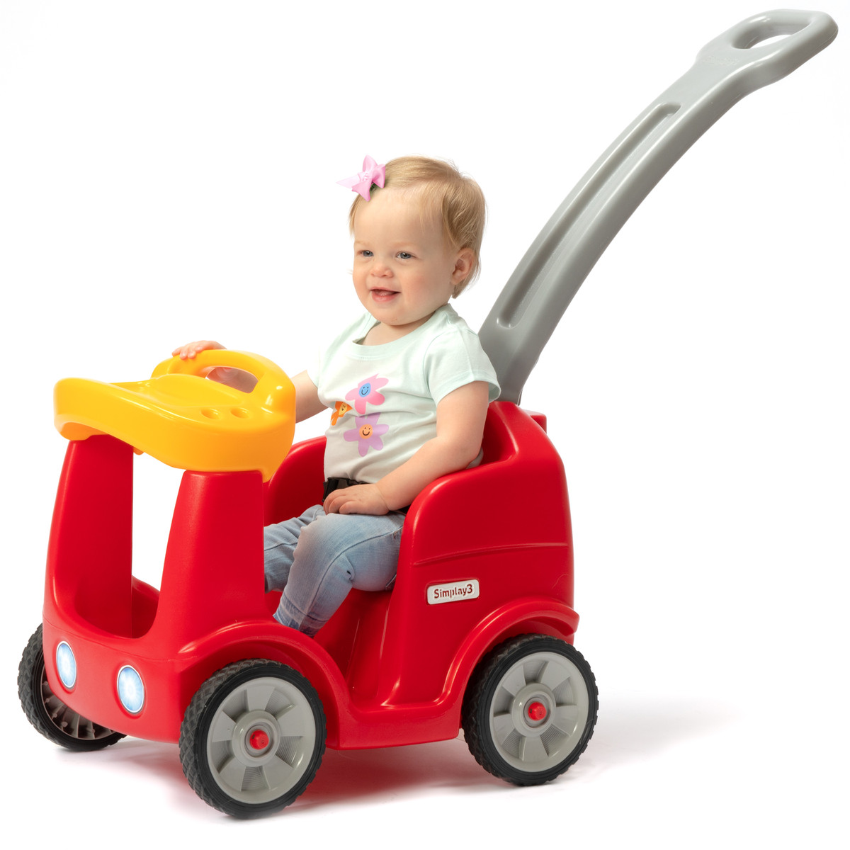 Toddler seated in Roll and Stroll Quiet Ride parent push car