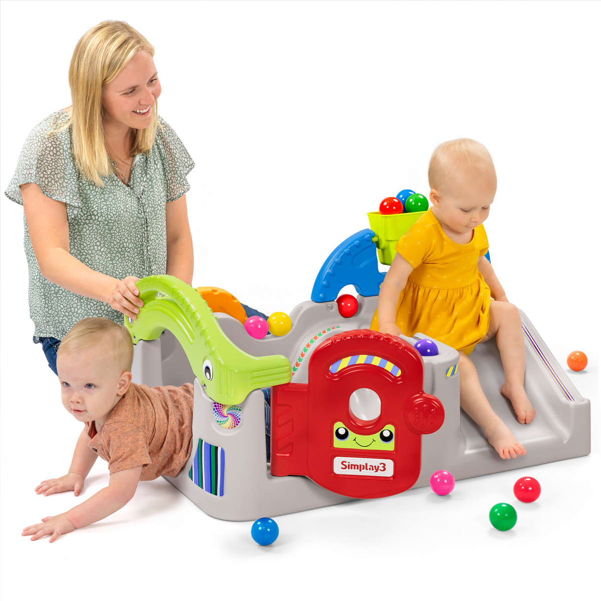 Toddlers playing in ball play activity center under Mom's watchful eye