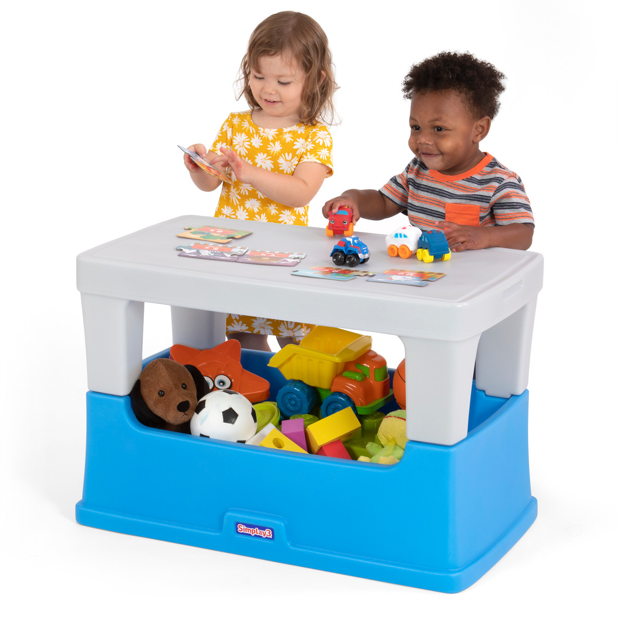 Children working on activities on the Simplay3 Play Around Storage Table 