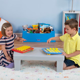 Kids playing a game on the Simplay3 Play Around Storage Table top