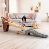 Toddler boy and girl racing on Simplay3 Safari Adventure Racetrack in a living room