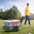 Woman pulling Simplay3 American Home Flat Bed Cart at sporting event with cooler, water